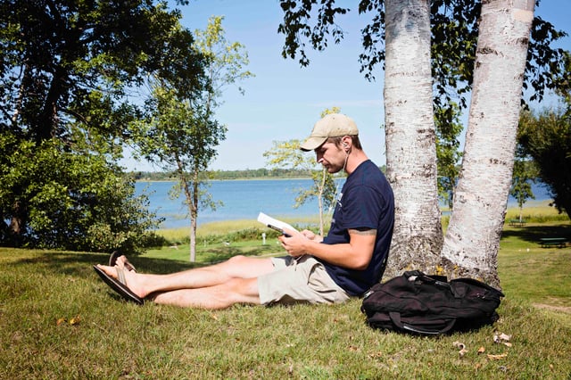 Steve_Daniels_under_tree_reading.jpg